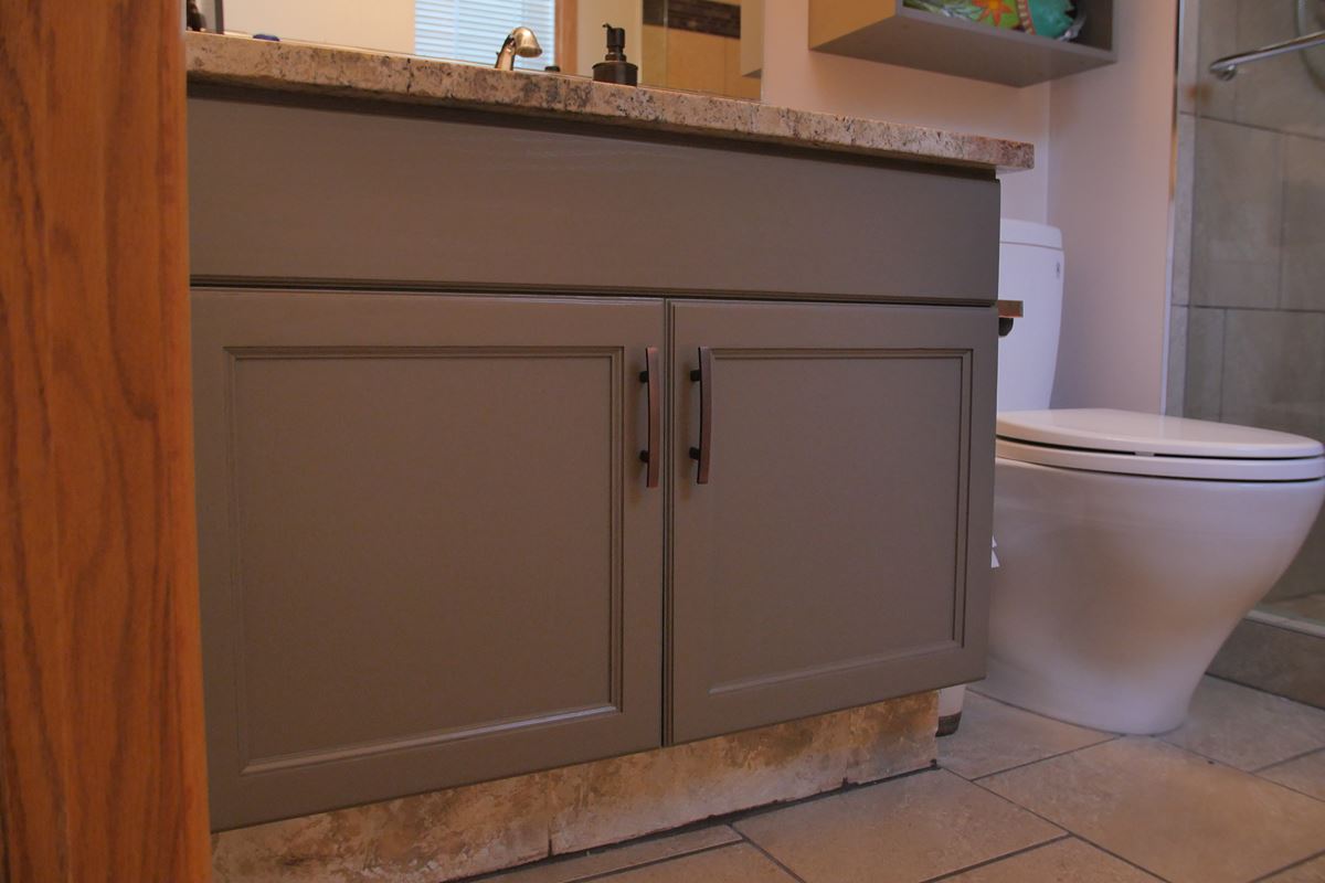 Modern grey bathroom vanity with stylish brushed hardware