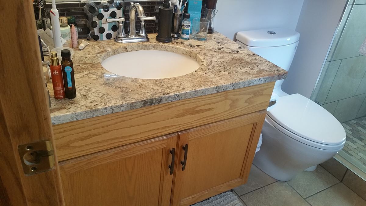 Yellow oak bathroom vanity before painting