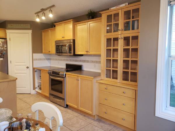 Yellow maple cabinets before painting