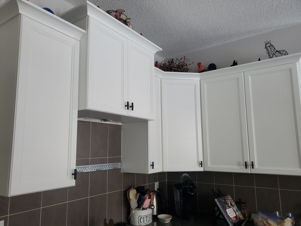 Dark Cabinets Repainted Off White after 3